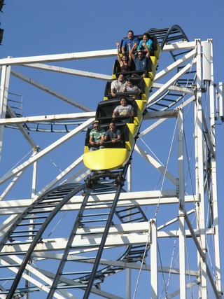 people on a rollercoaster
