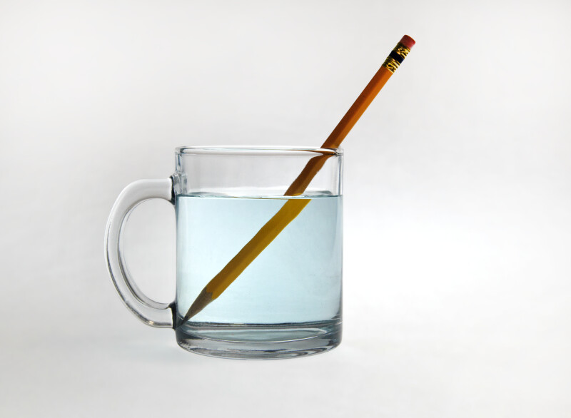 a pencil in a glass of water demonstrating refraction