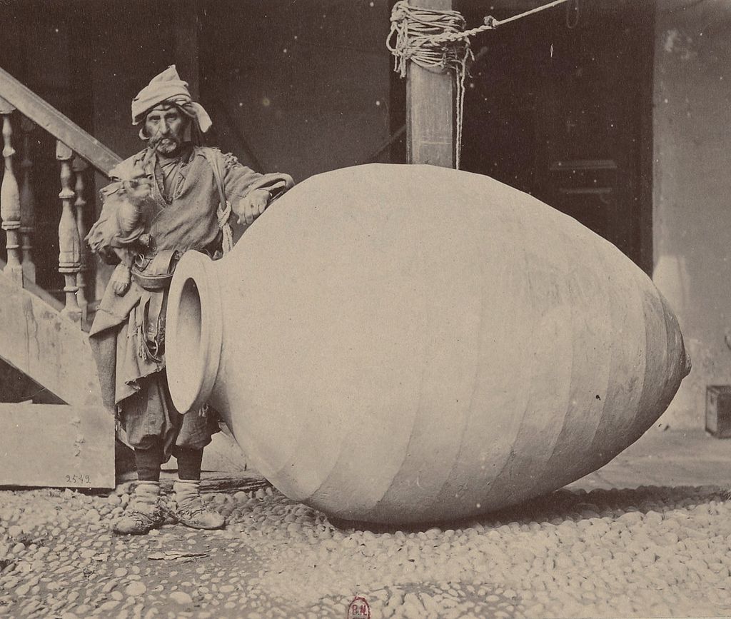 Photograph of a winemaker and a kvevri from 1881